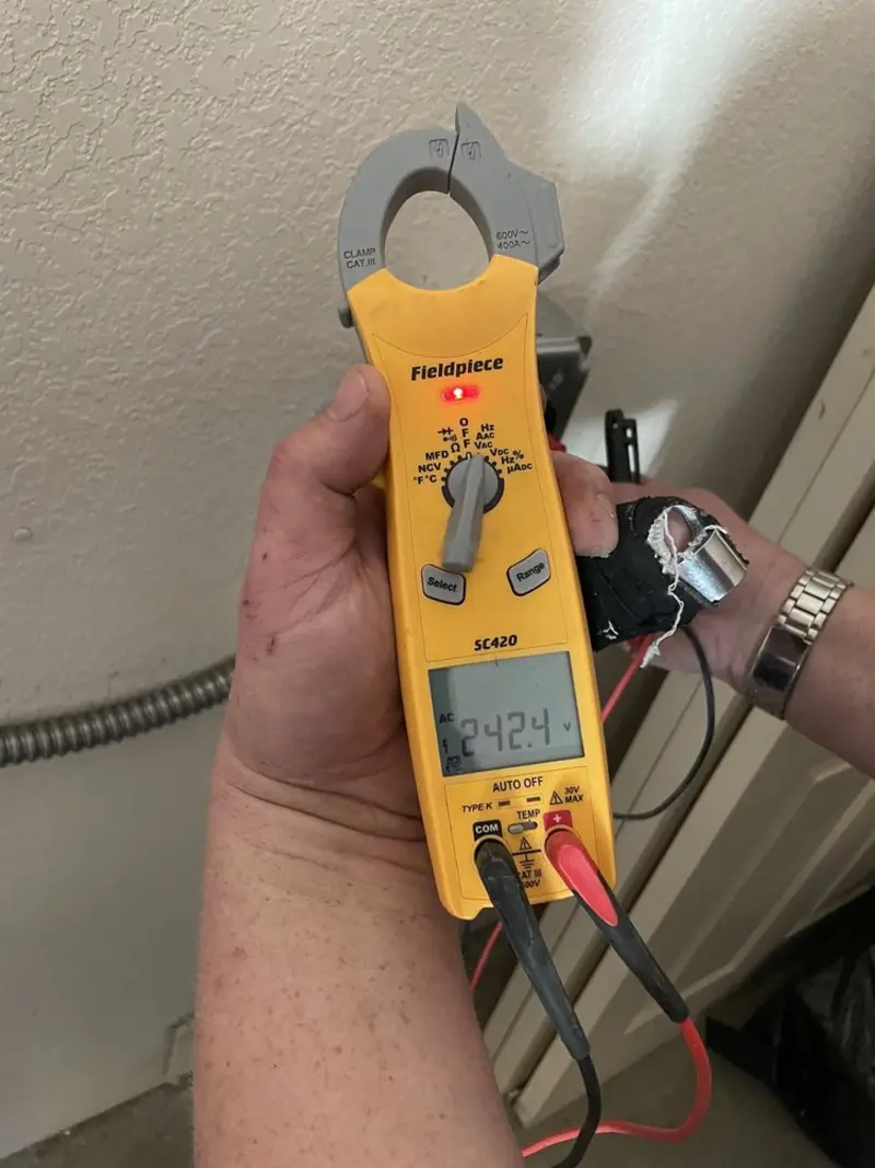 Voltage testing with clamp meter during Electrical Installation Services in Shorewood Forest